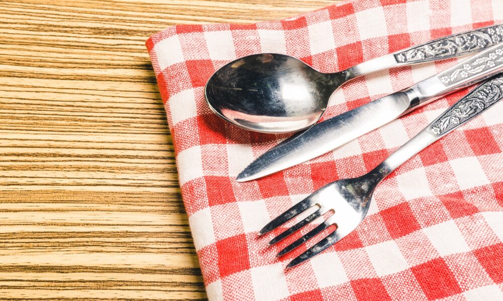 fork-and-table-knife-on-red-gingham-tablecloth