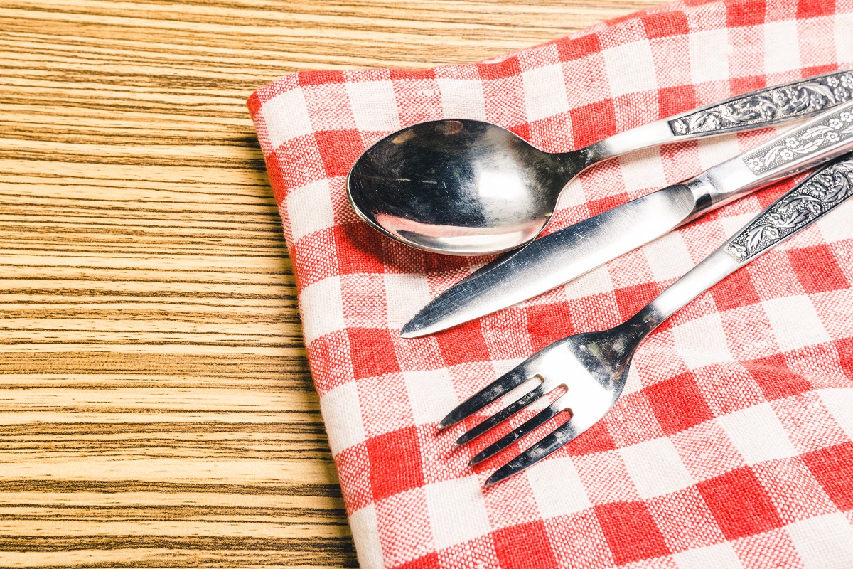fork-and-table-knife-on-red-gingham-tablecloth