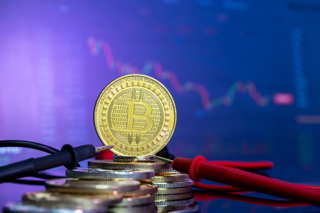 golden-bitcoin-blue-reflective-surface-top-other-coins-histogram-currency-1024x683